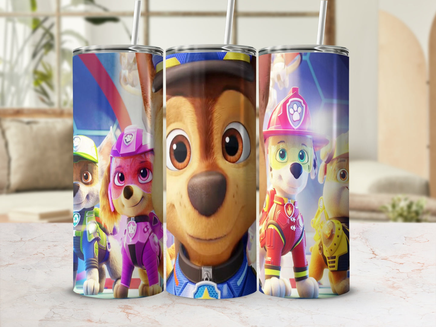 Paw Patrol characters Chase, Skye, and Marshall on a blue and red patterned tumbler.