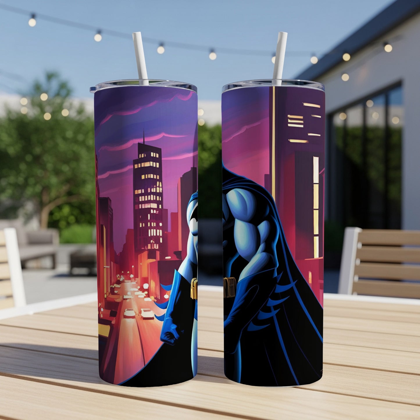 Batman standing in a city skyline at dusk, artwork on two tumblers.