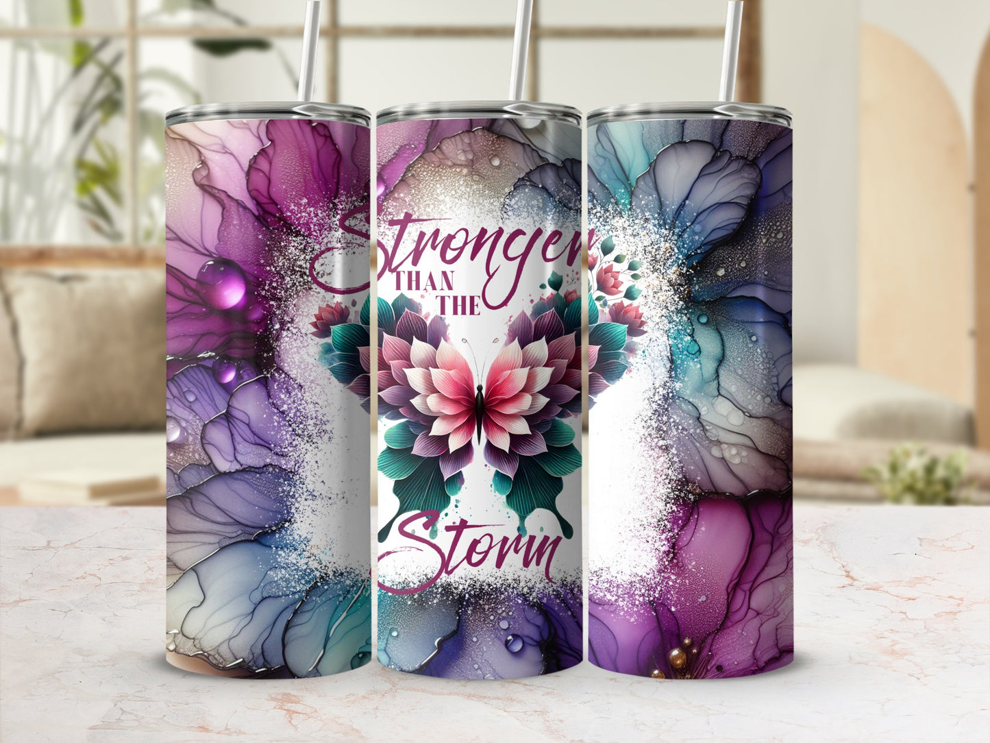 Pink and purple floral watercolor tumbler with "Stronger Than The Storm" text.