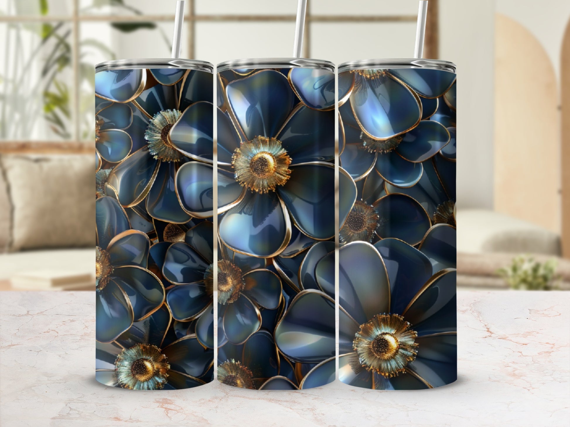 Three dark blue floral tumblers with gold accents stand side-by-side.