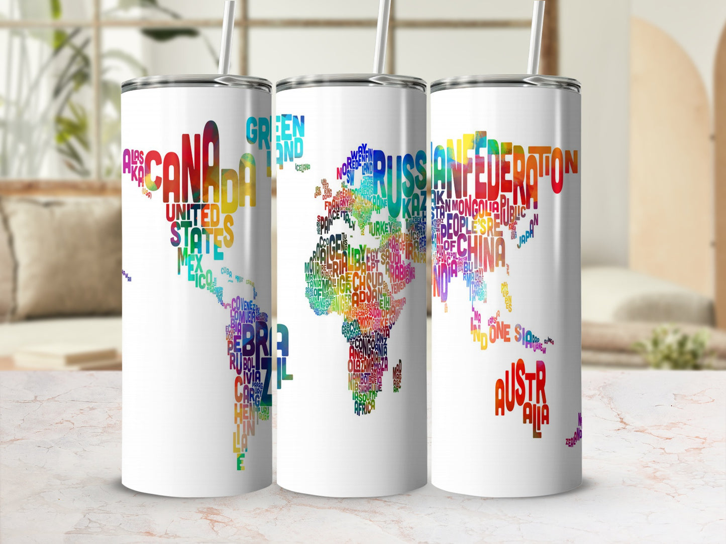 Three white tumblers with colorful world map country names for North America, Europe, Asia, Africa, and Australia.