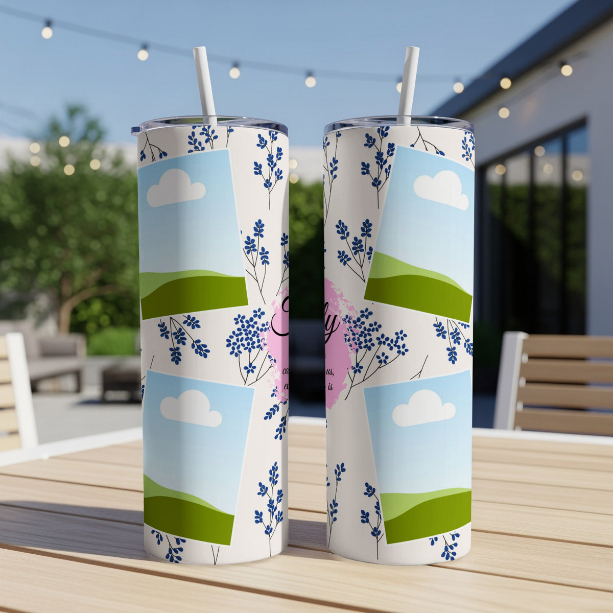 Tumbler with "Family" text and blue floral pattern.