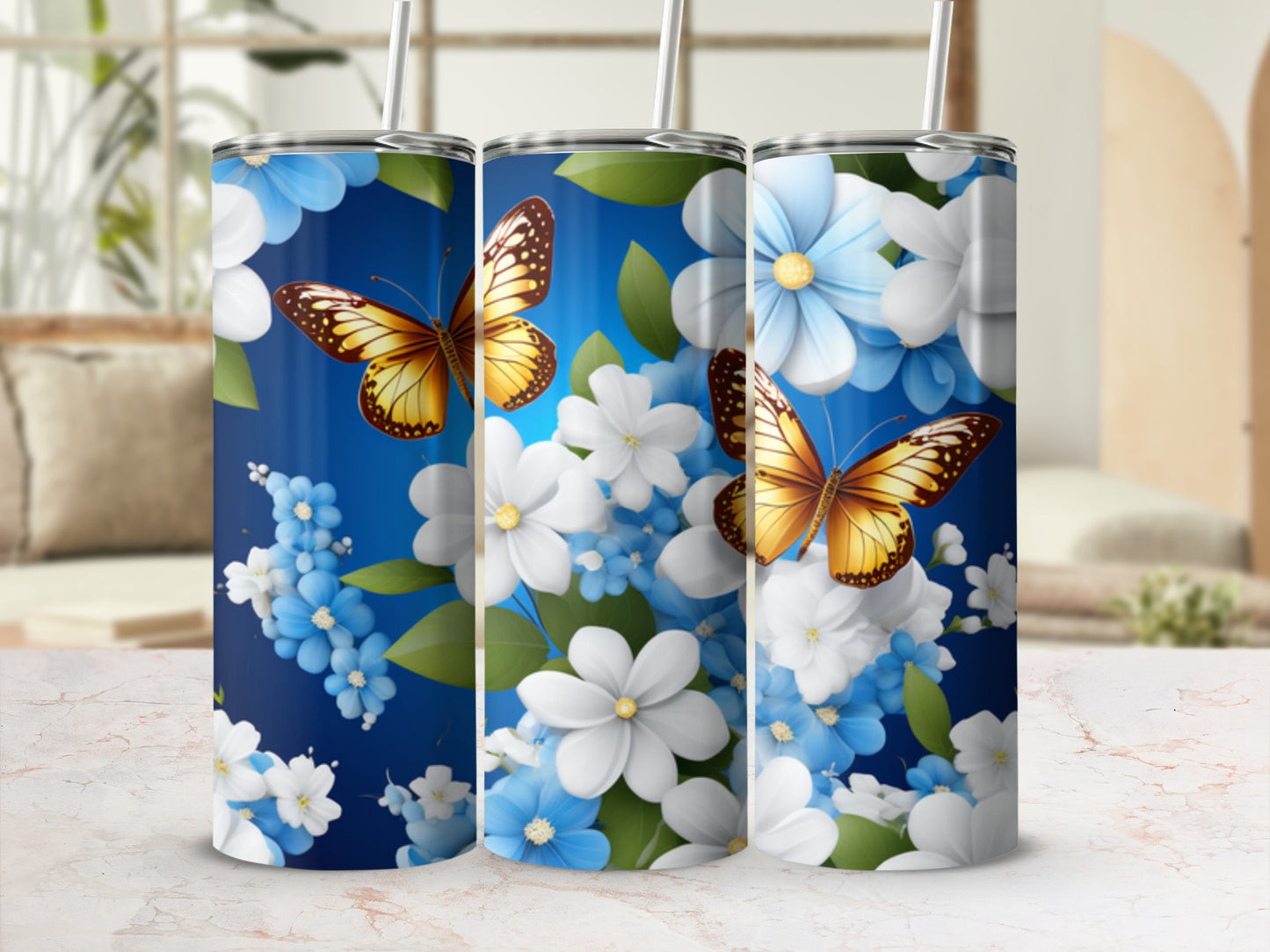 Blue tumbler with white and blue flowers and orange butterflies.
