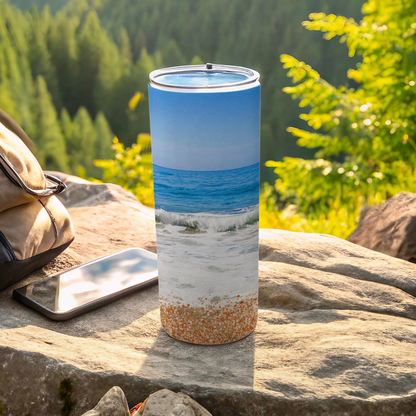 Tall tumbler with ocean waves and beach sand design.