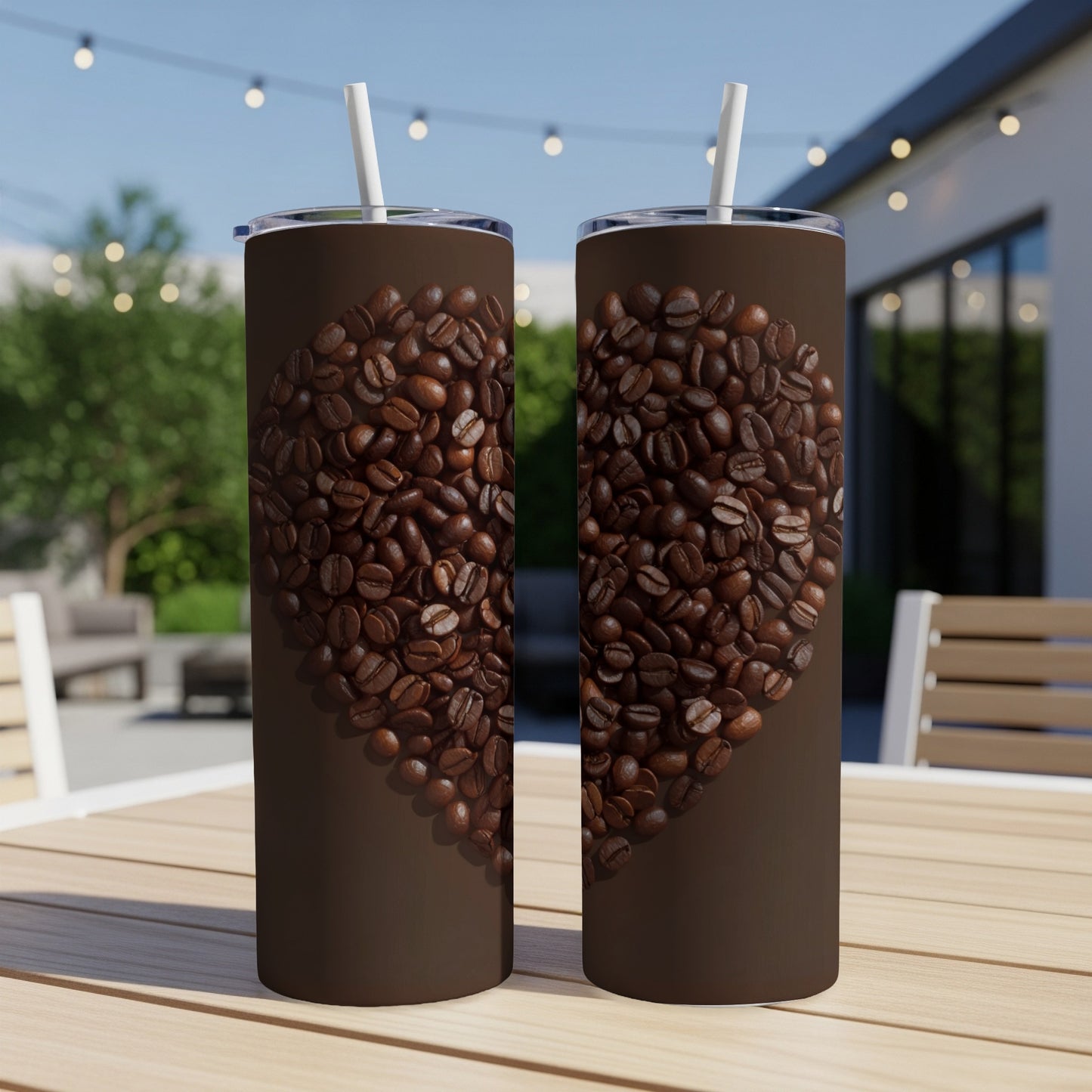 Two tumblers with a heart shape made of coffee beans on a wooden table.