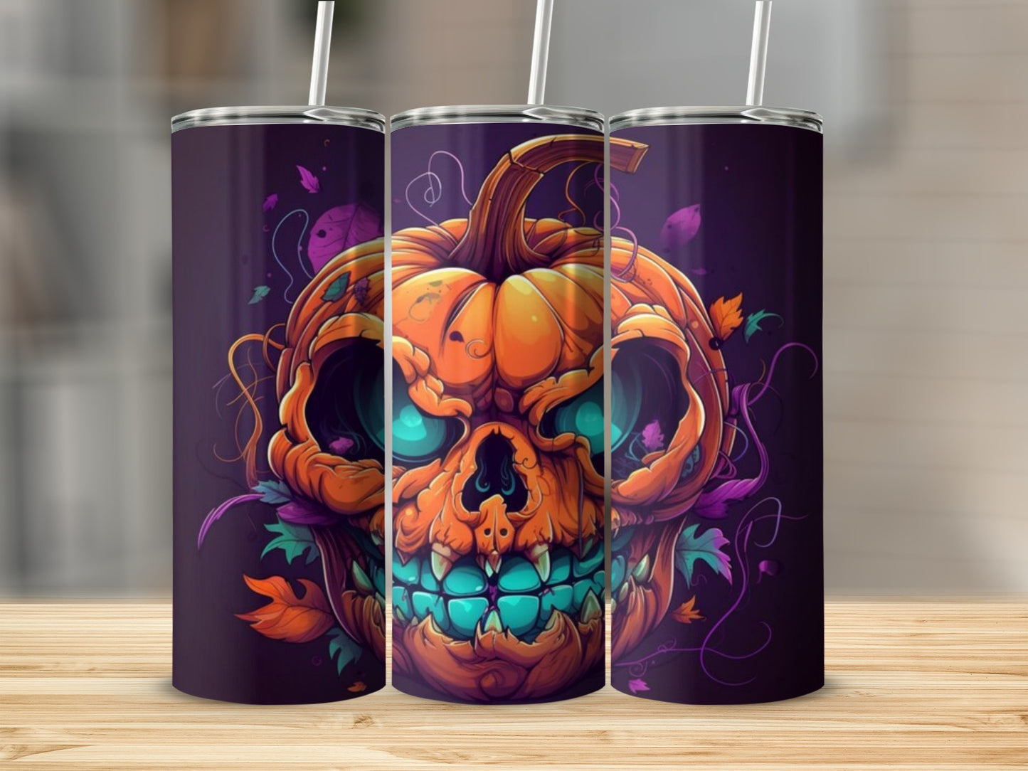 Halloween pumpkin skull design on three tumblers with straws.