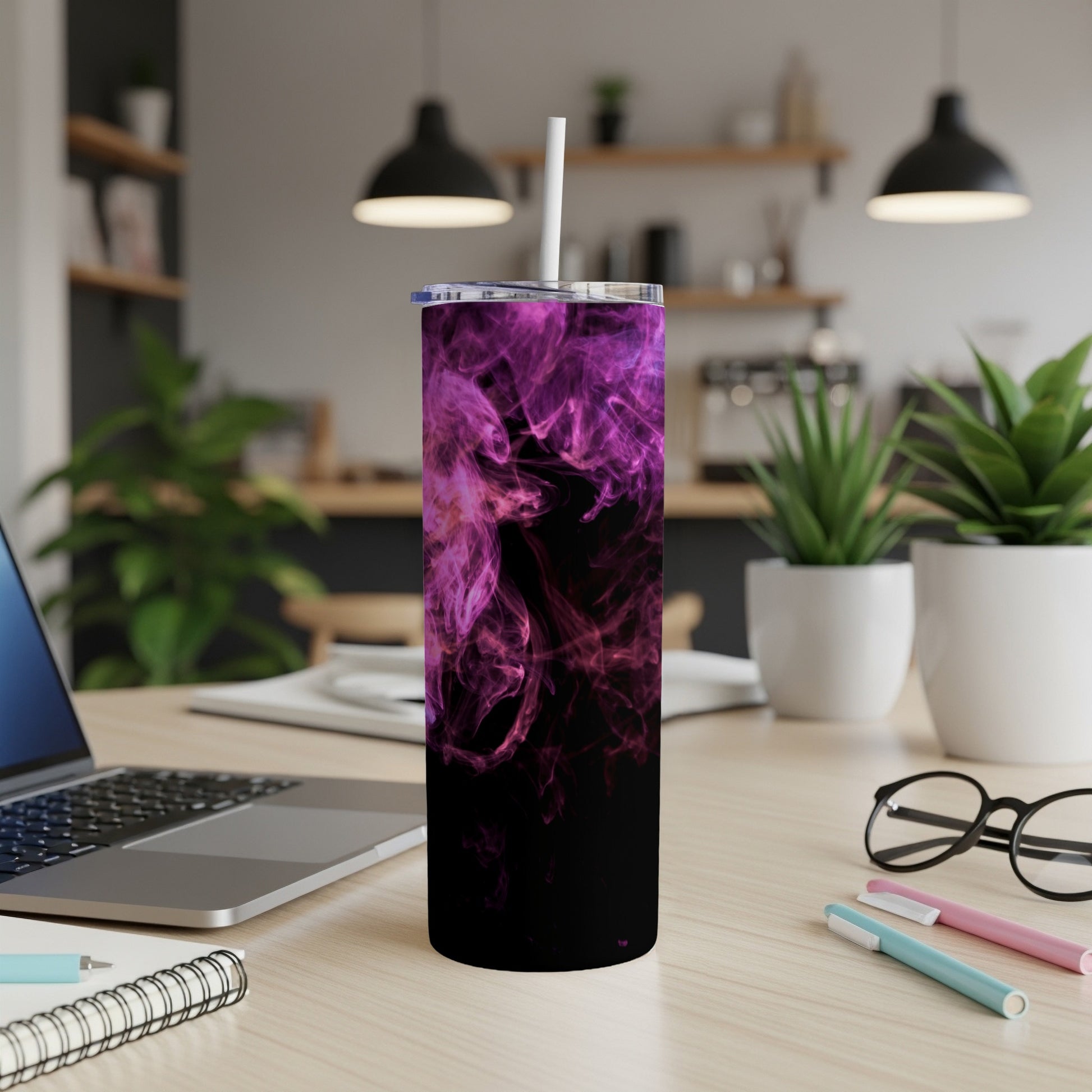 Black tumbler with purple smoke design and white straw.