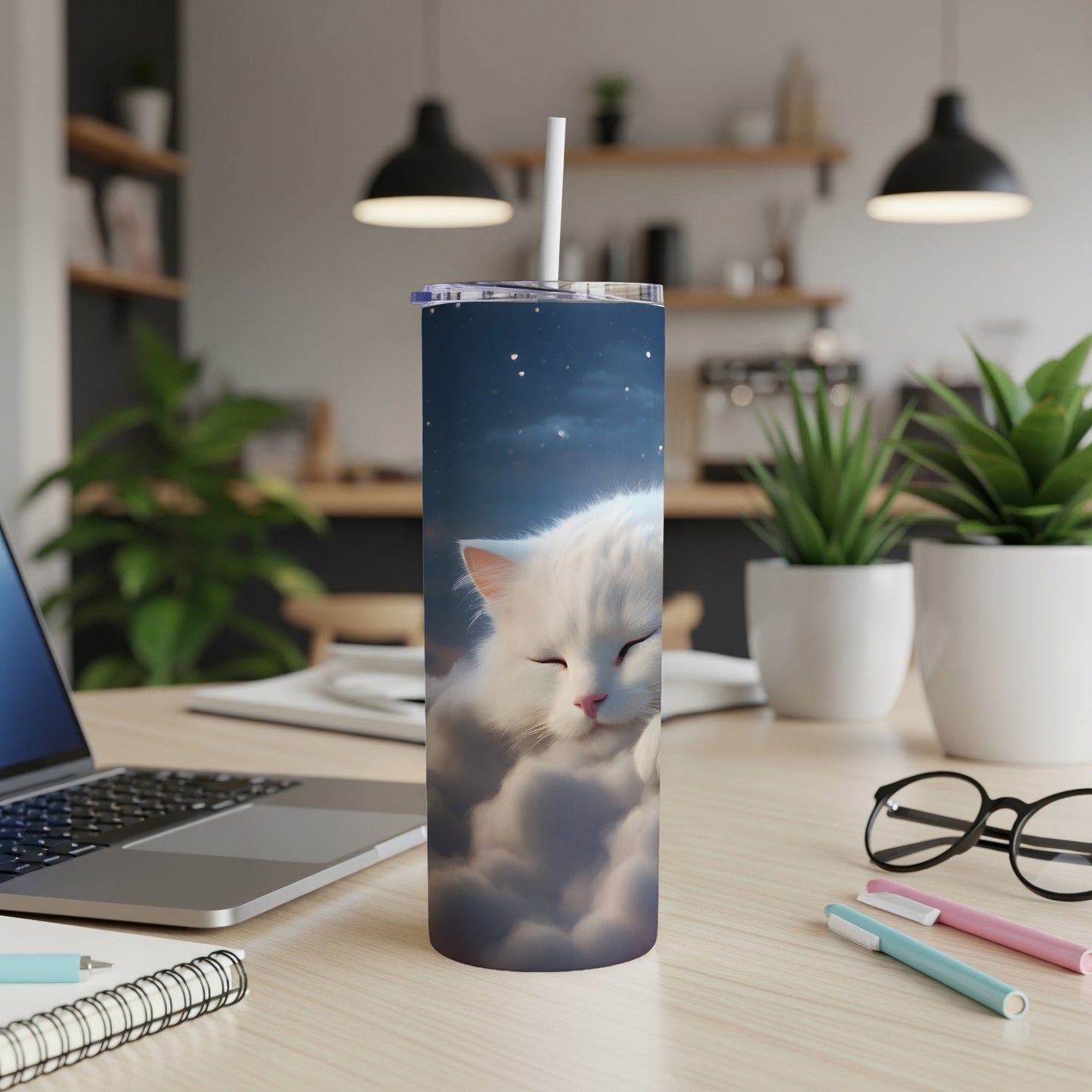 White cat sleeping on clouds with starry sky, on a desk.