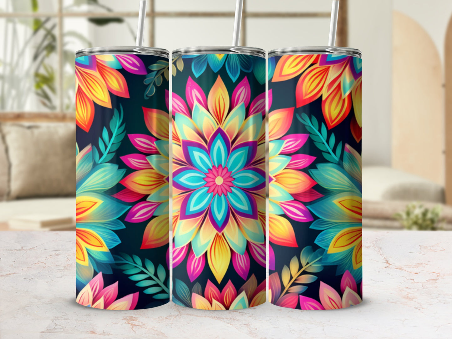 Three tumblers with colorful floral mandala designs and green leaves.