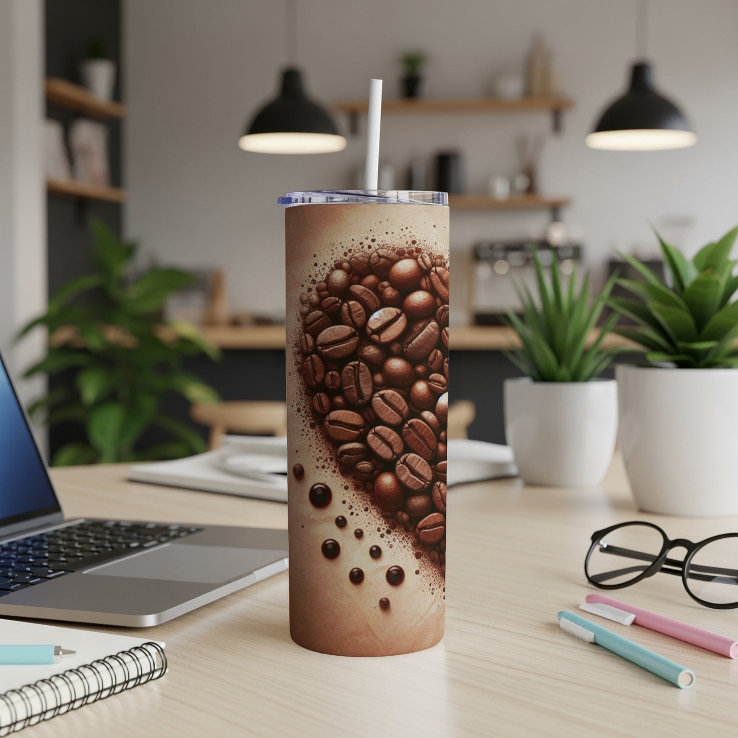 Tumbler with heart-shaped coffee beans design and white straw.