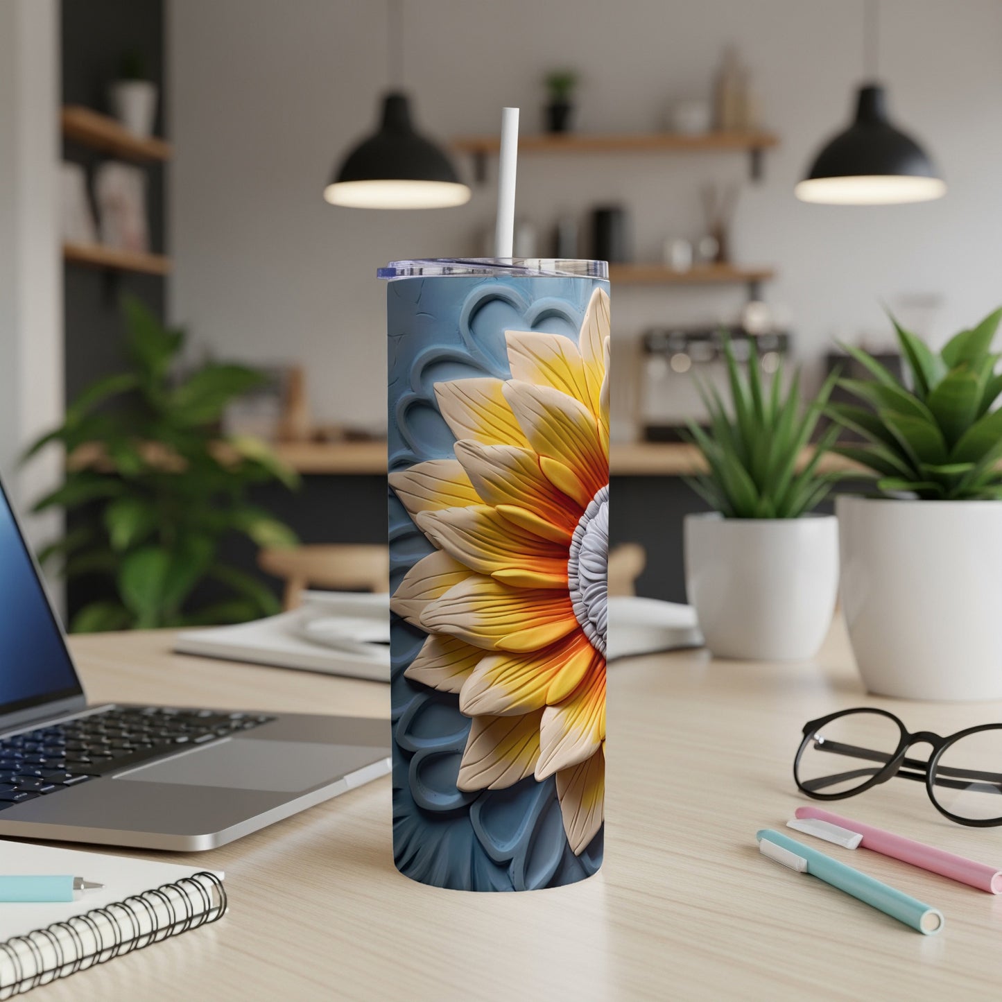 Sunflower tumbler with textured blue floral background and white straw.