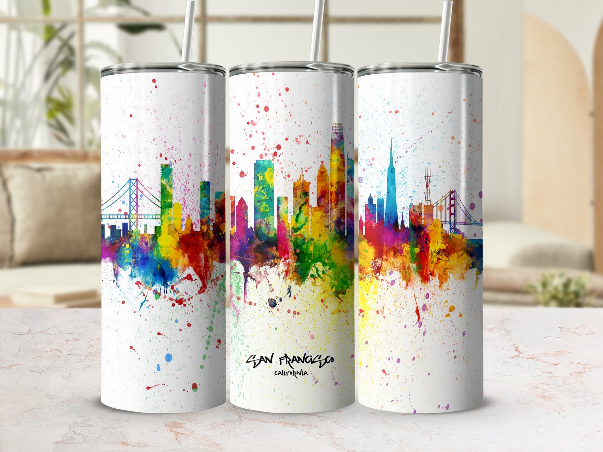 Three tumblers with San Francisco skyline art and splatter details.