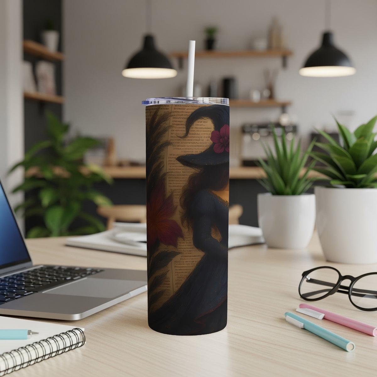 Tumbler with witch silhouette, floral accents, and vintage text design.