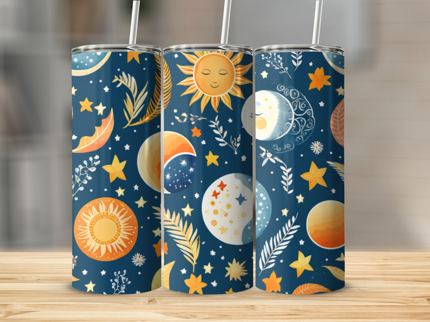 Cosmic celestial pattern on three tumblers with sun, moon, and stars.