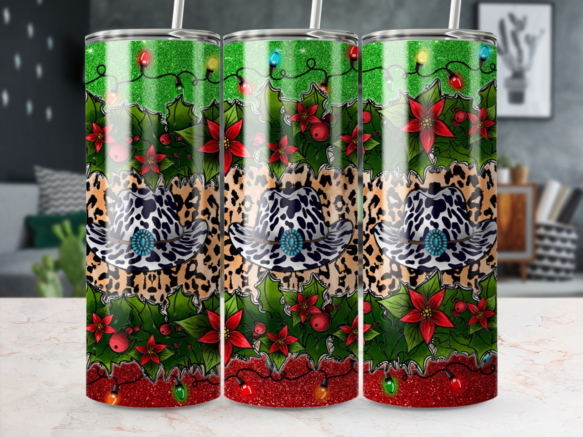 Three tumblers with leopard print, cowboy hat, holly, and Christmas lights.