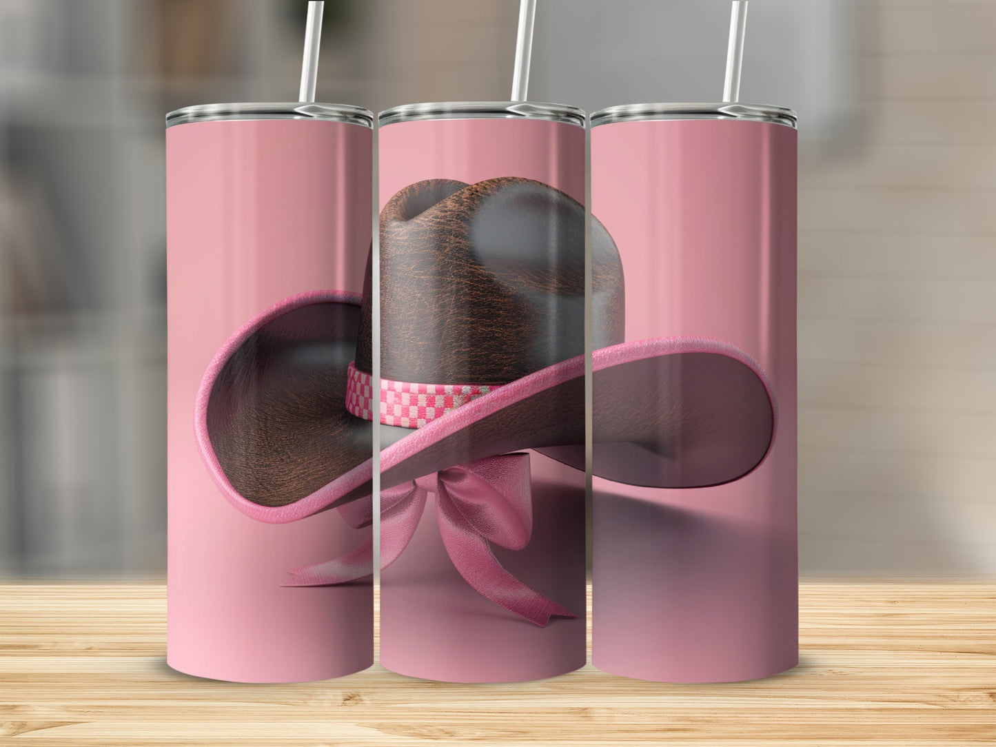 Pink tumbler with cowboy hat and pink ribbon design.