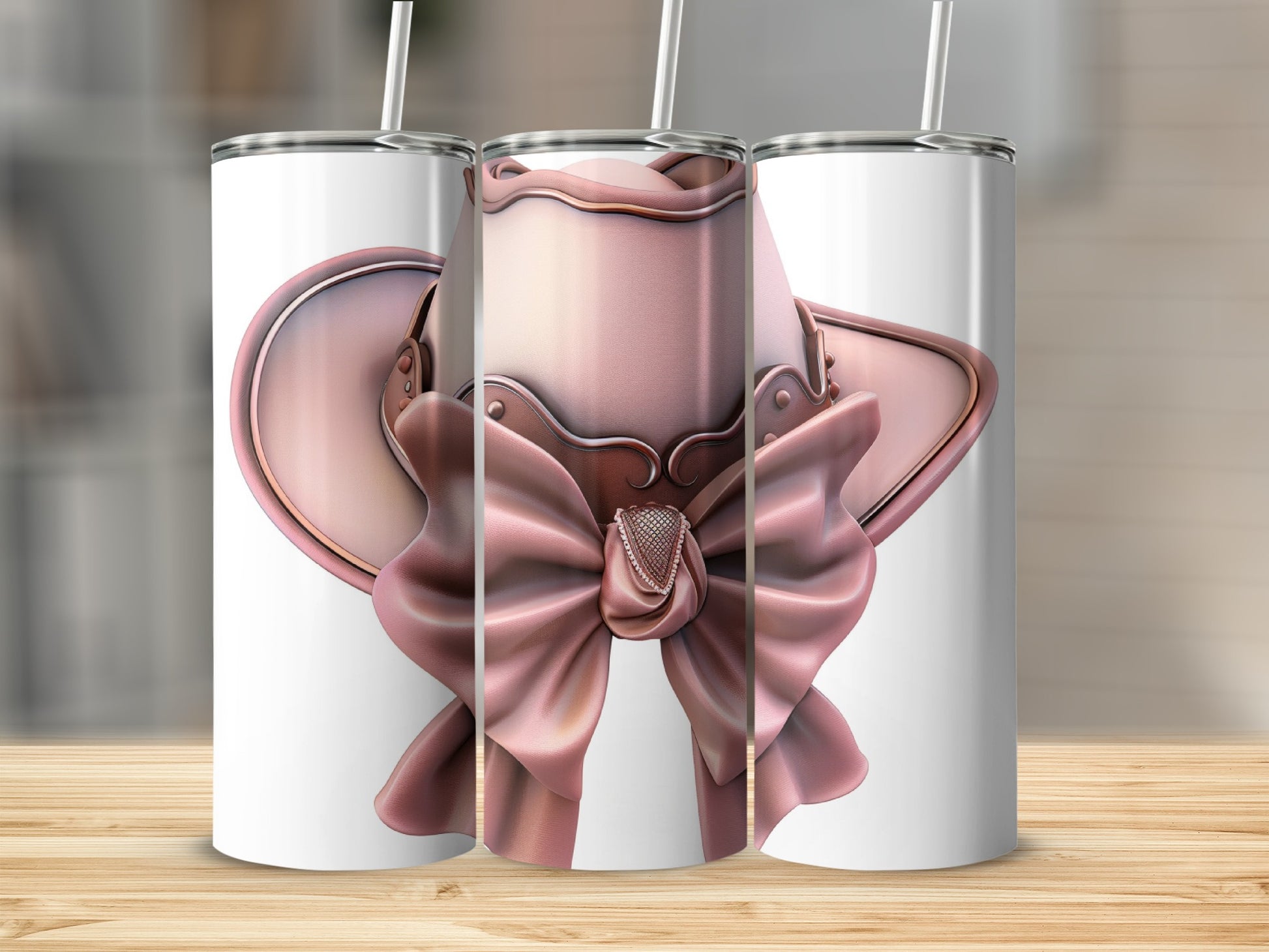 Pink glitter cowboy hat with bow on white tumblers.