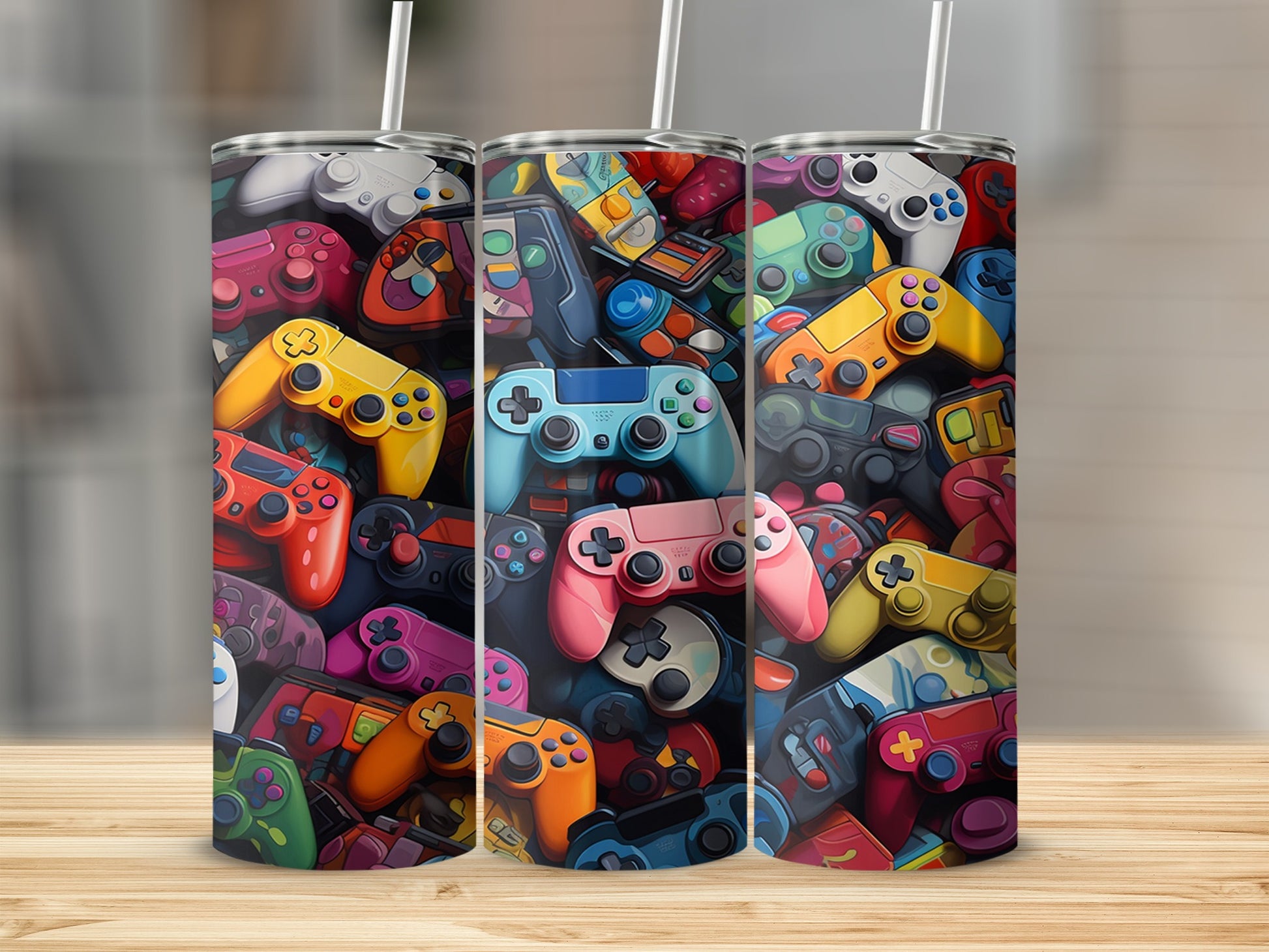 Three tumblers with a collage of colorful video game controllers.