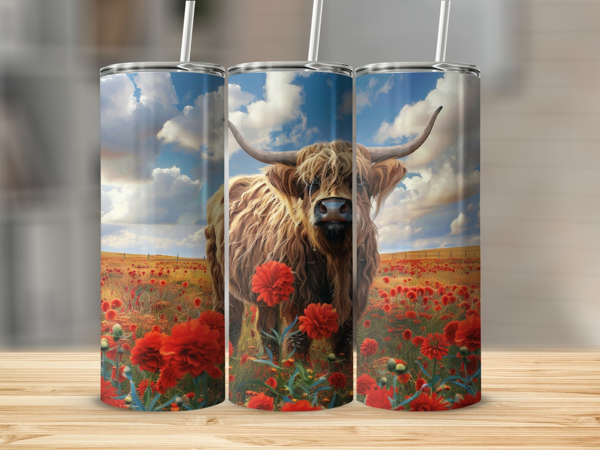 Three tumblers featuring a Highland cow in a field of red flowers and a blue sky.