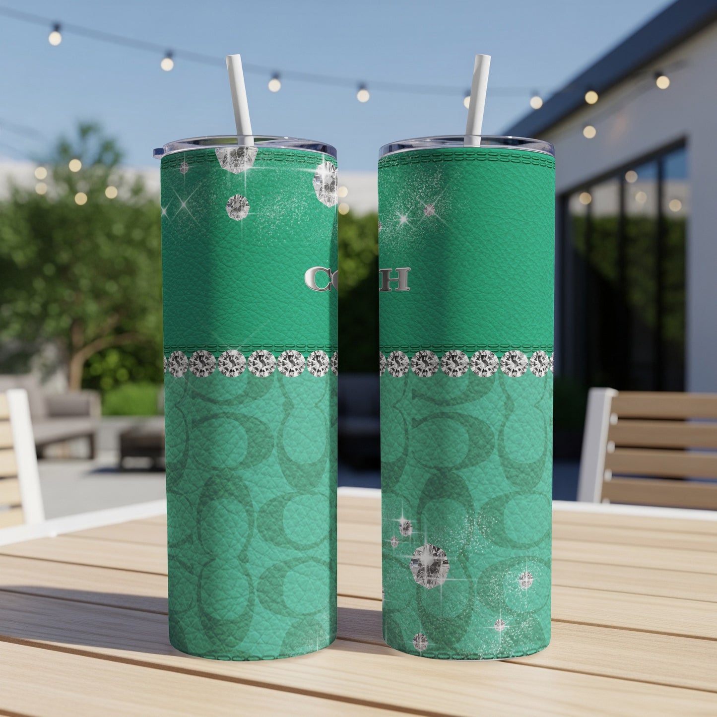 Two green tumblers with diamonds and Coach logo on textured background.