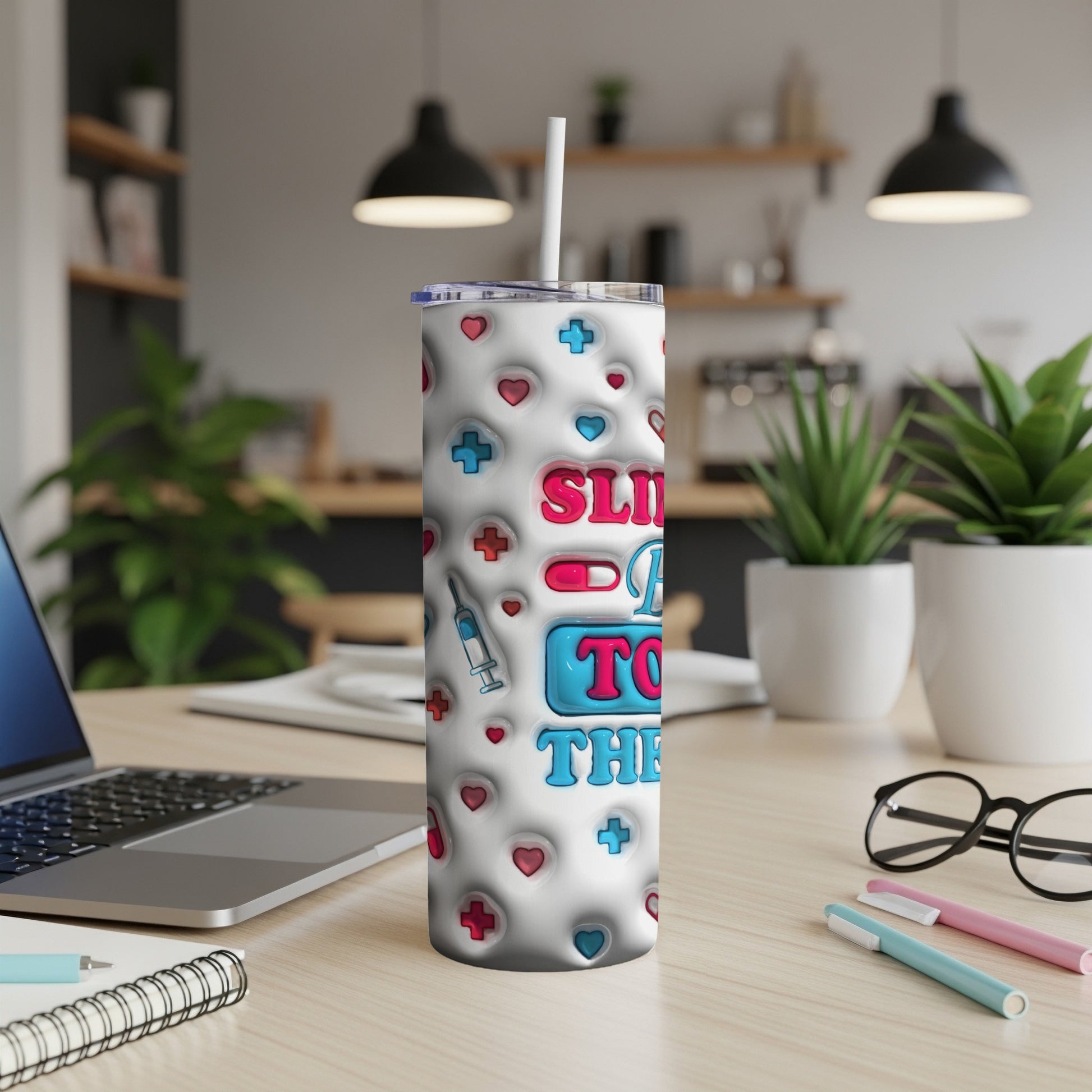 White tumbler with medical symbols and "Slide into the day" text.