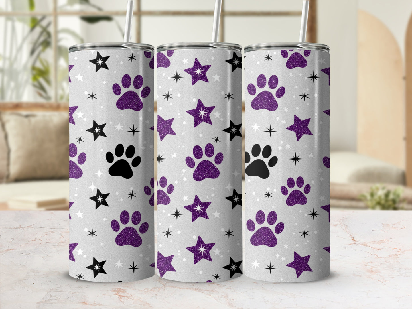 Three tumblers with paw prints and star pattern.