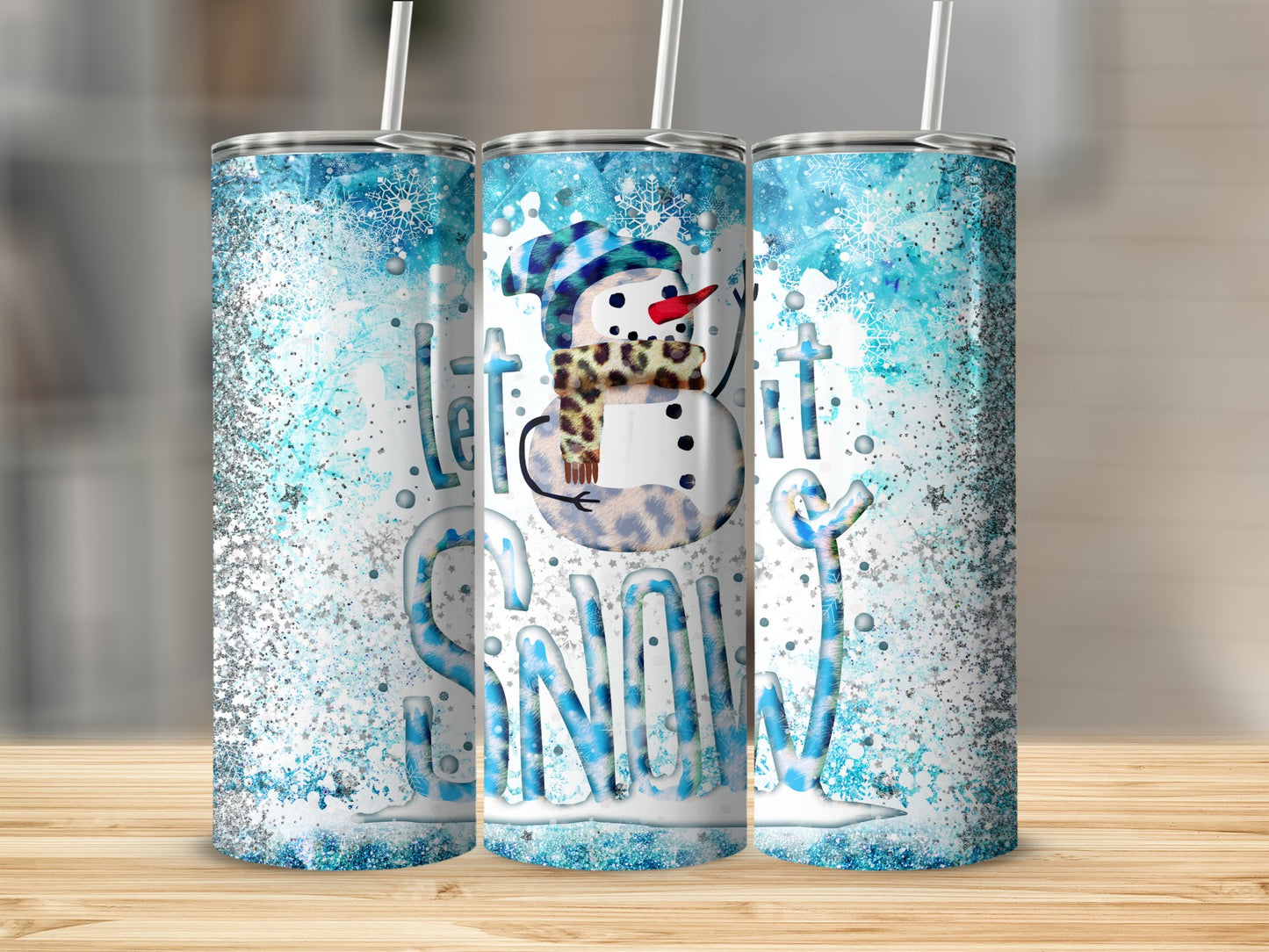 Snowman with "Let it Snow" text and glitter design on three tumblers.