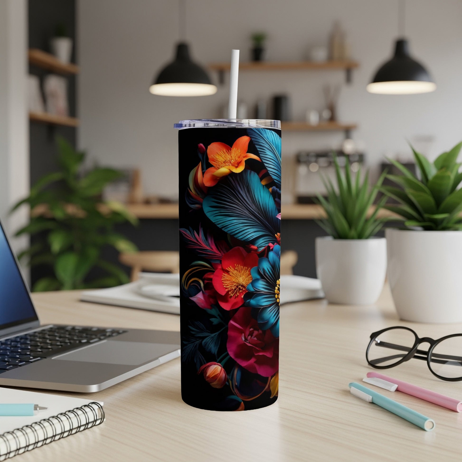 Black tumbler with vibrant floral design and white straw.