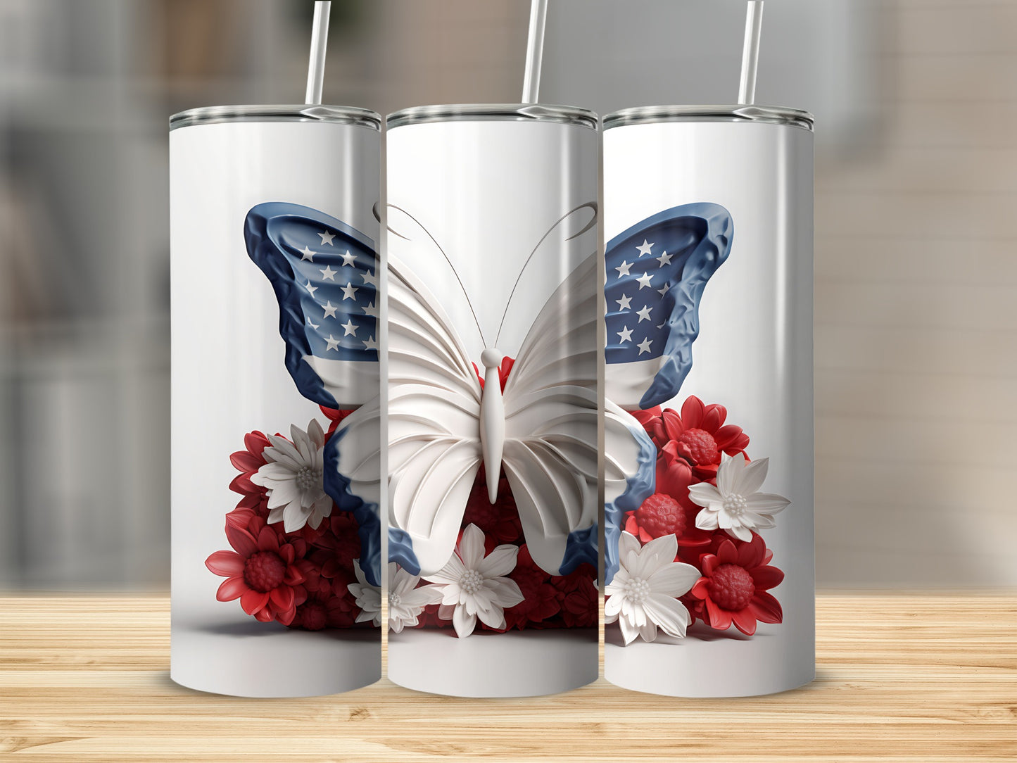 Three tumblers featuring a white butterfly with American flag wings on red and white flowers.