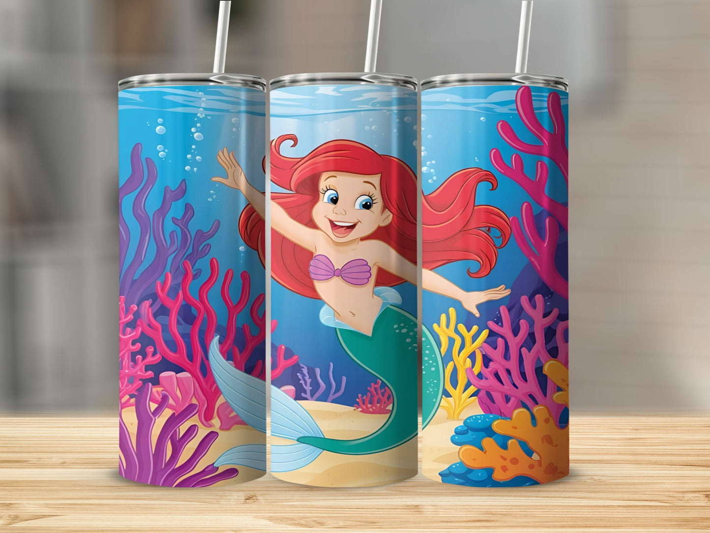 Ariel the mermaid smiling underwater with colorful coral and plants.