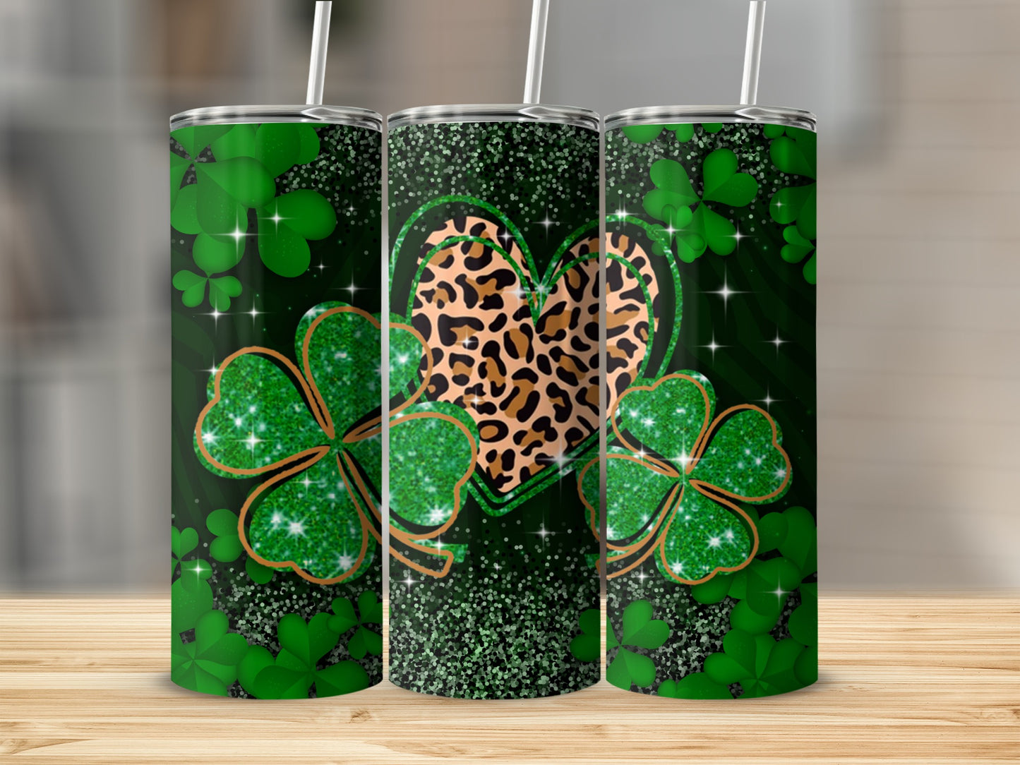 Green shamrocks, leopard print heart, and glitter on a themed tumbler.