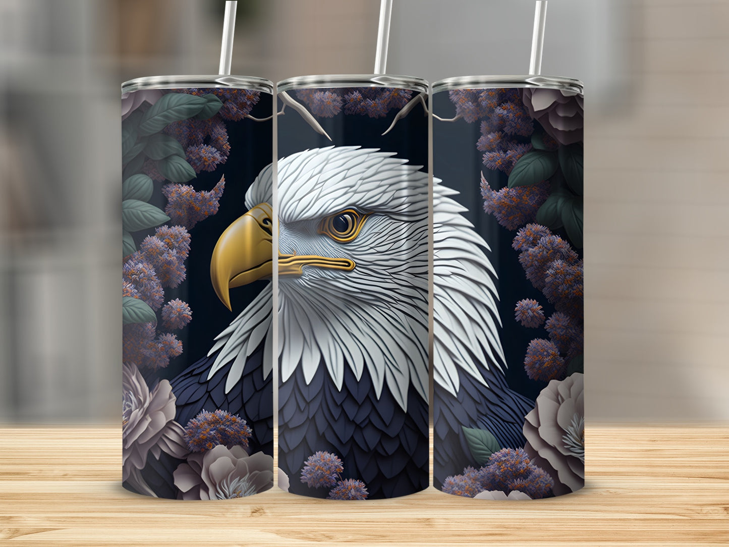 Triptych of tumblers featuring an eagle head with purple flowers and dark foliage.
