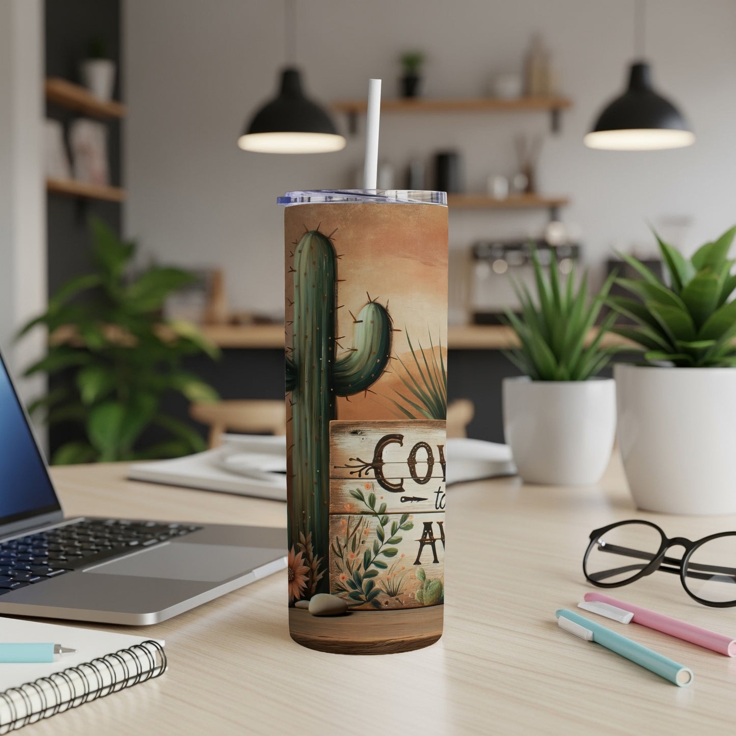 Tumbler with desert cactus and "Cowboy Up" text in a wood sign design.