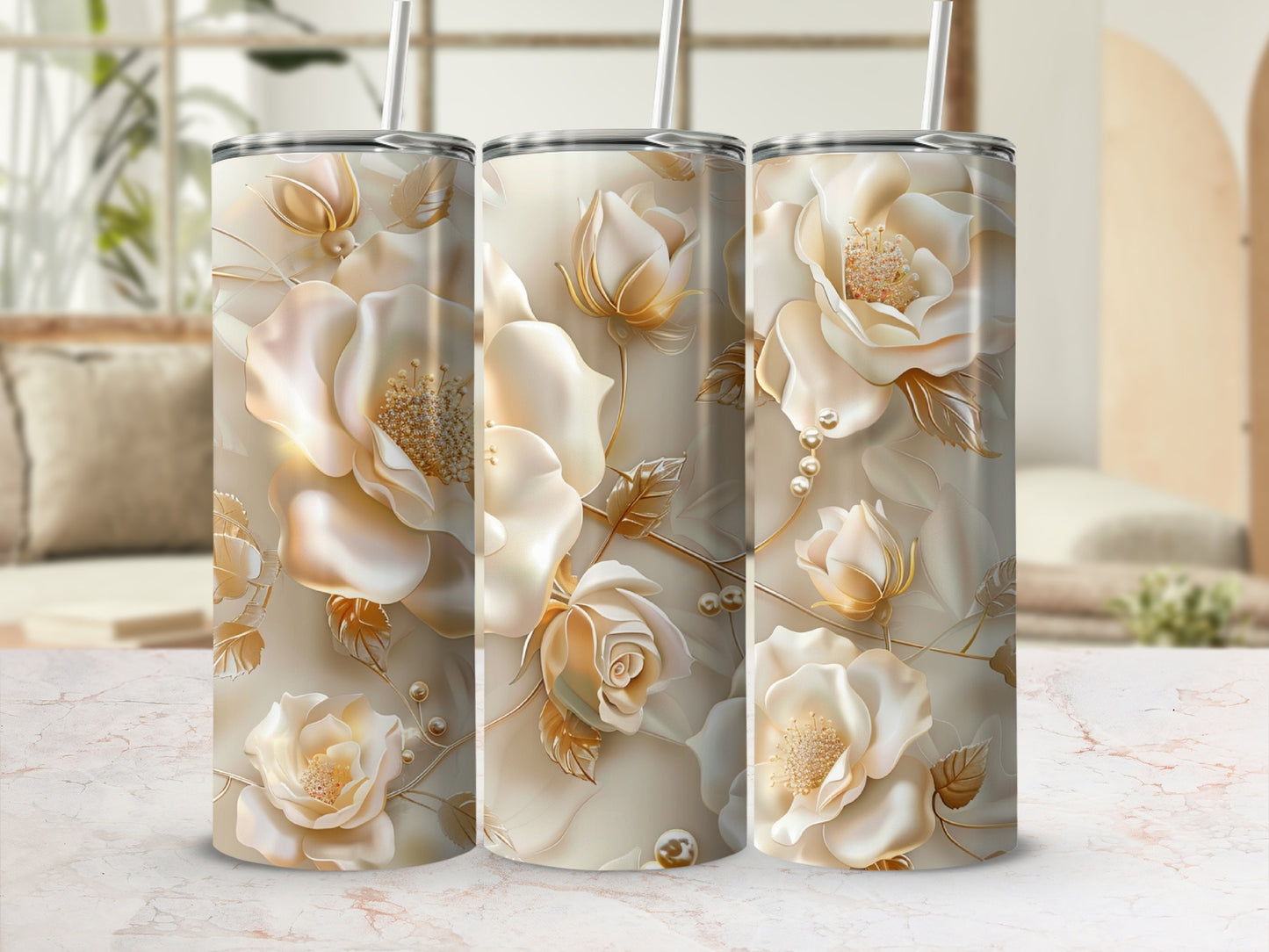 Three tumblers with a floral rose design and gold accents.