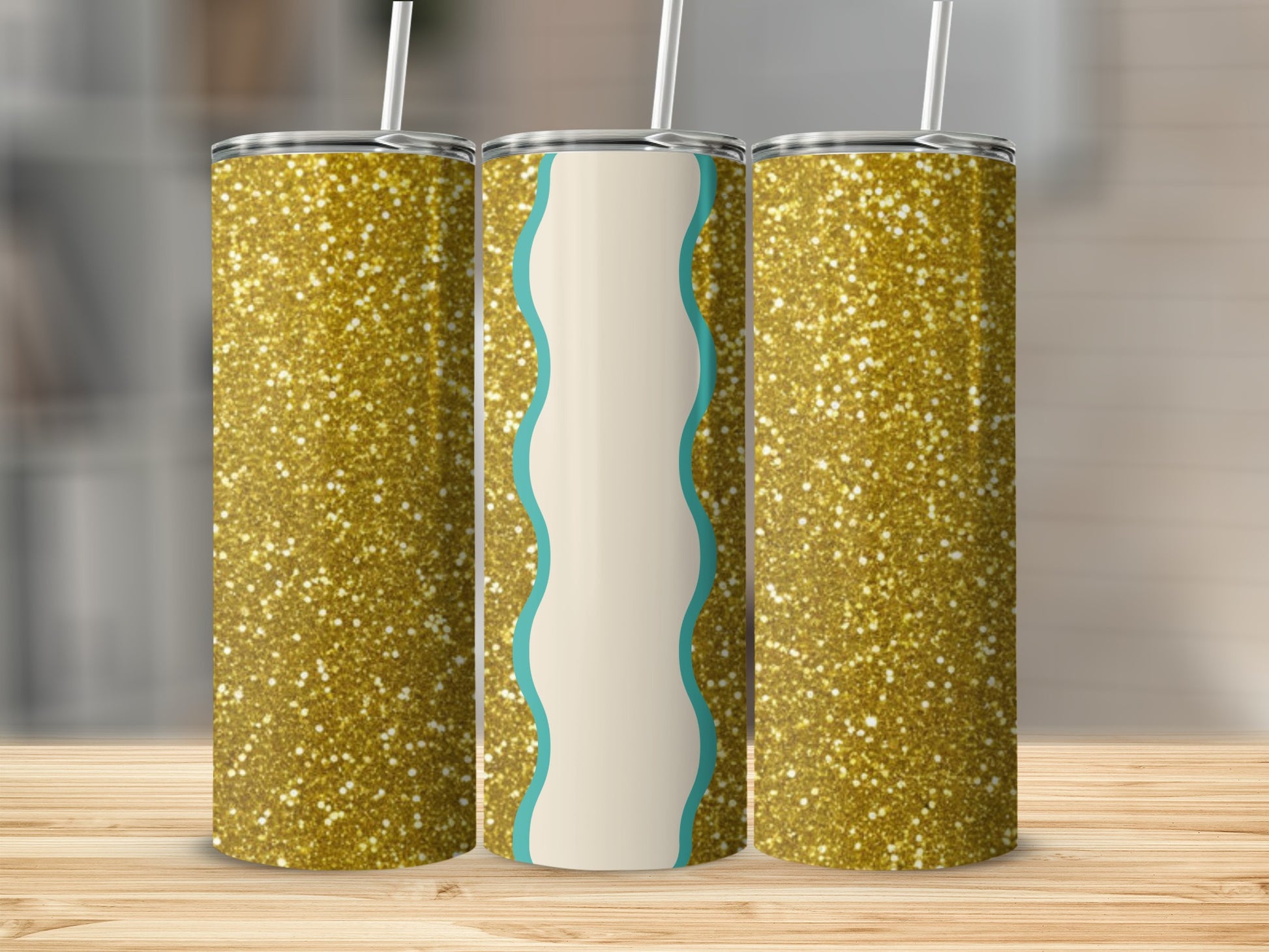 Three glitter tumblers with straws on a wooden surface.