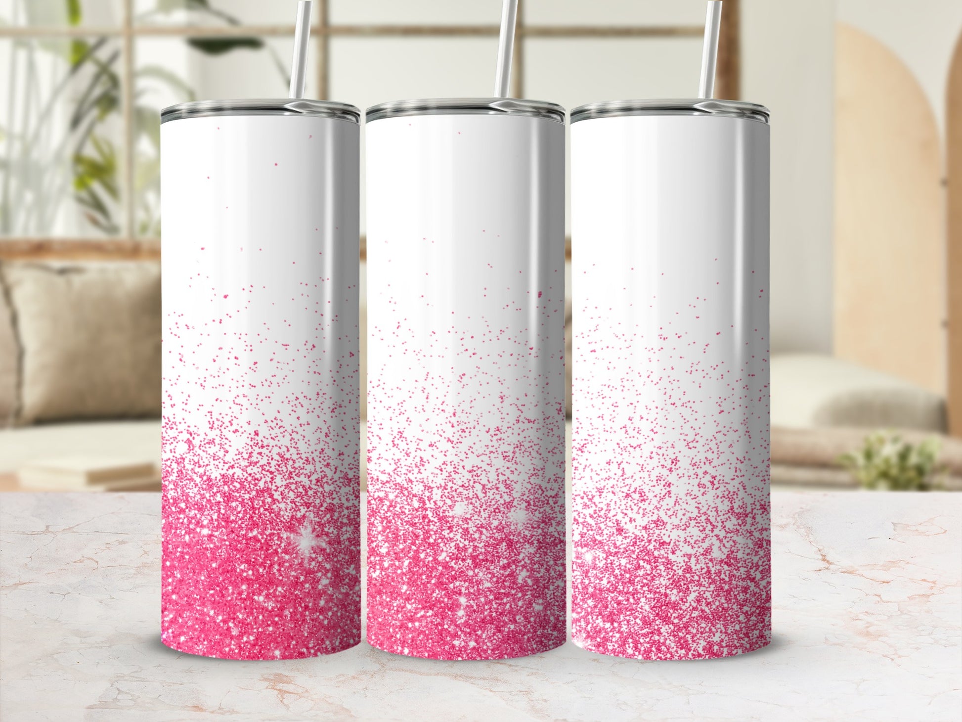 Three white tumblers with pink glitter gradient, straw in each.