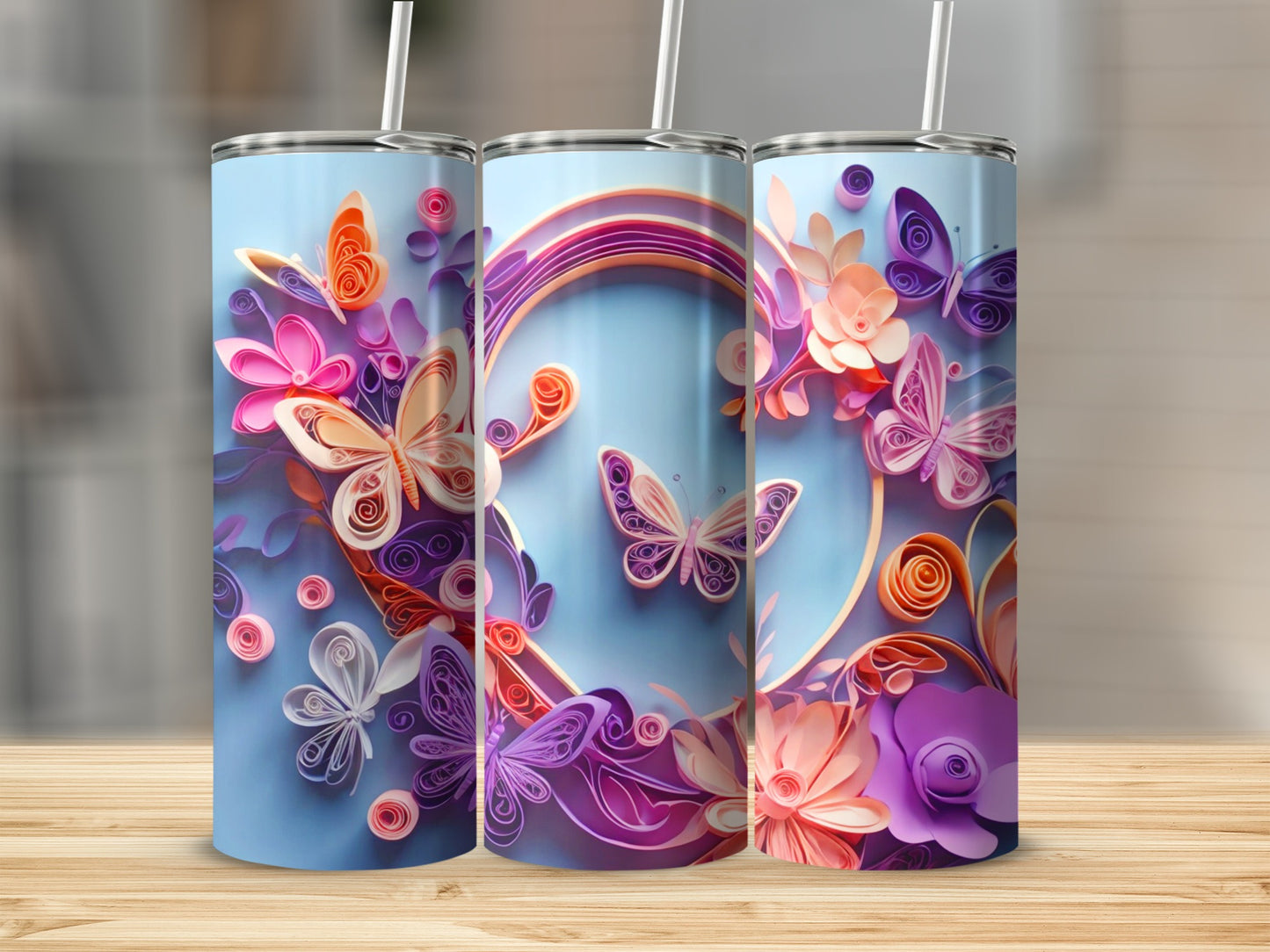 Tumbler with quilled butterflies and flowers in shades of pink, orange, and purple.