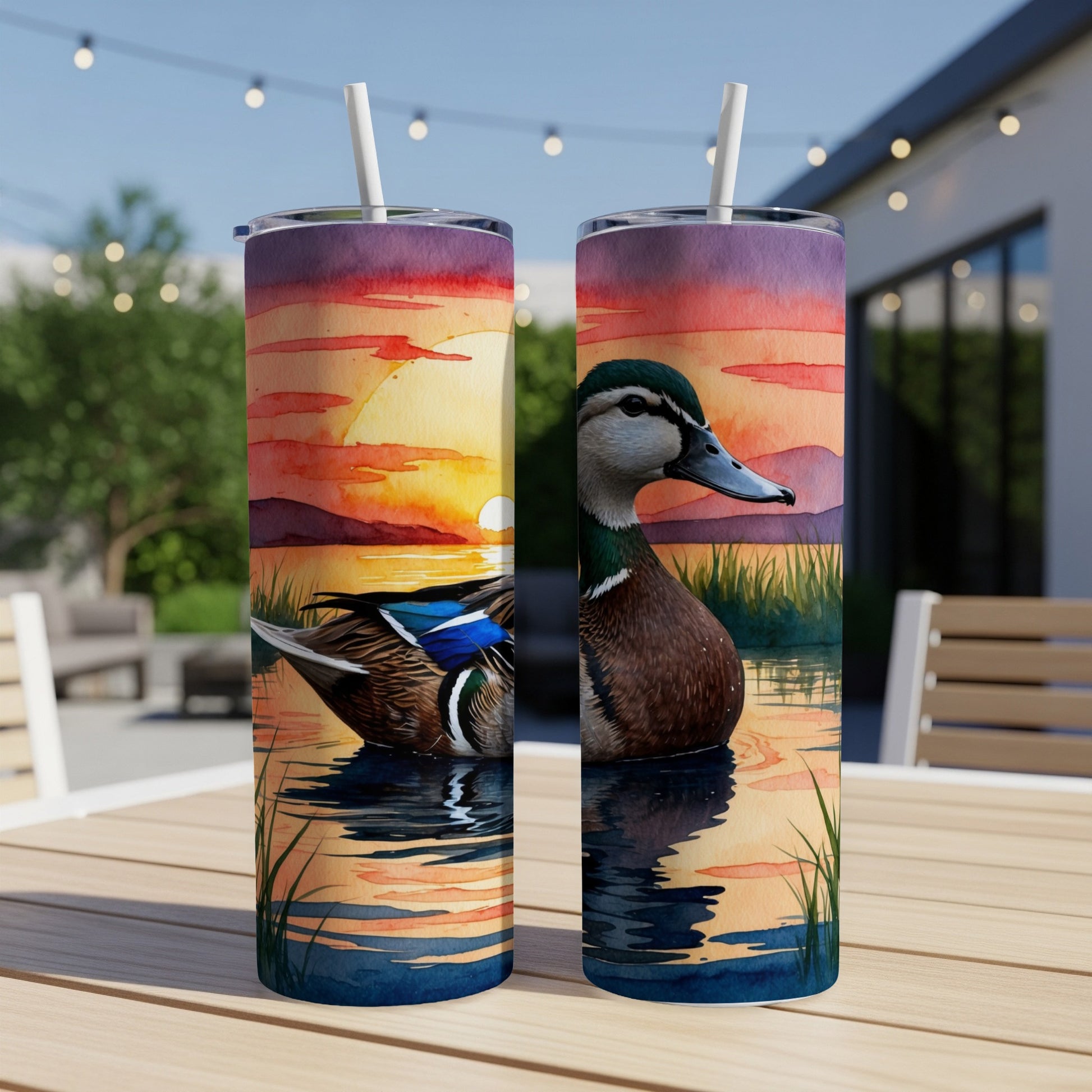 Mallard duck on water with sunset and reeds design on two tumblers.