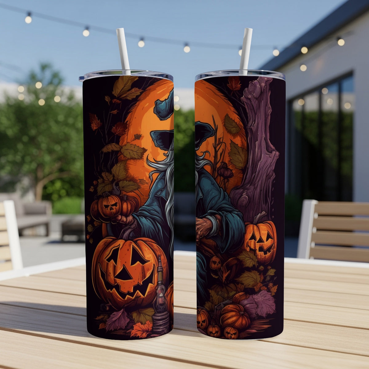 Two tumblers with a Halloween design featuring a wizard, pumpkins, and autumn leaves.