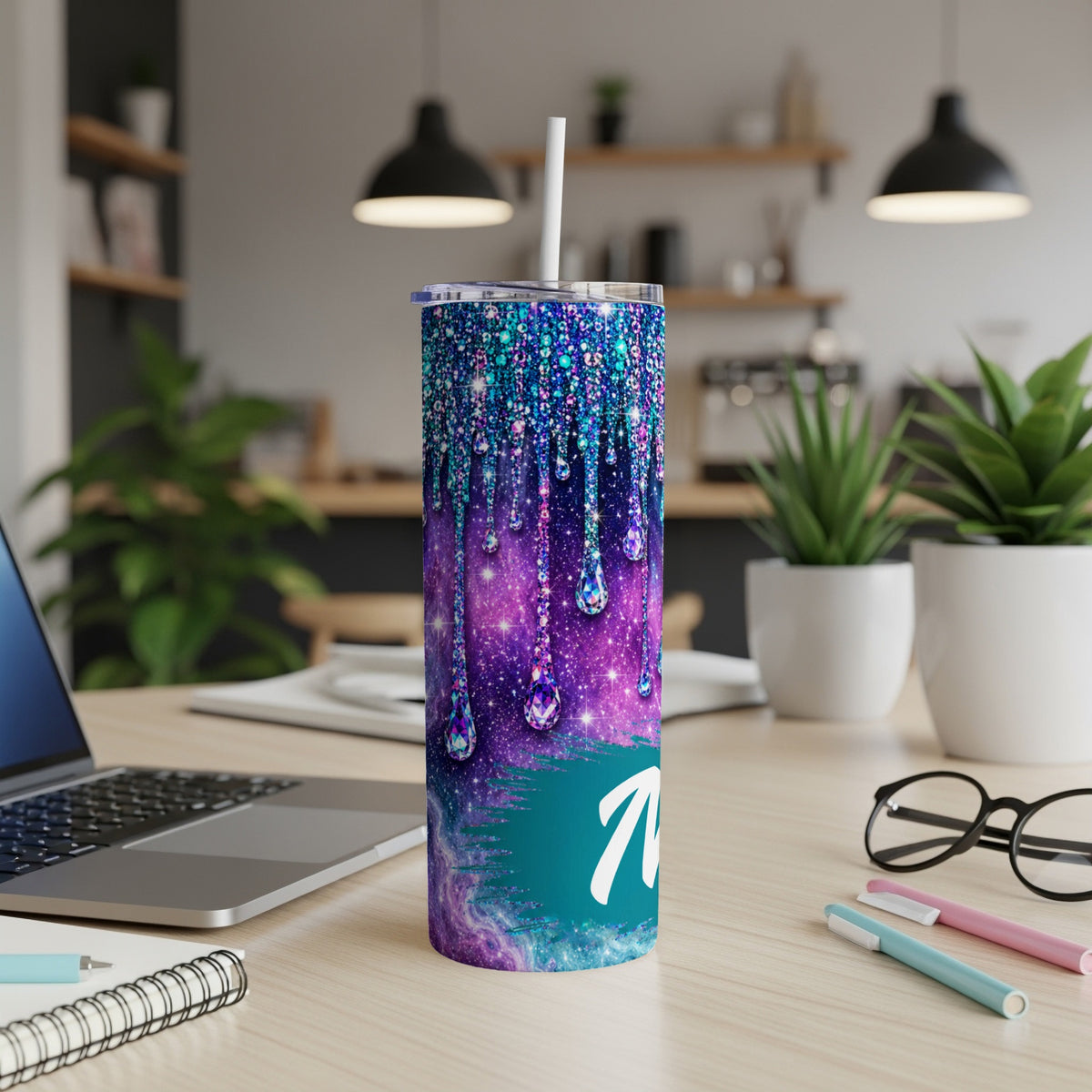 Tumbler with galaxy drip design and white letter N.