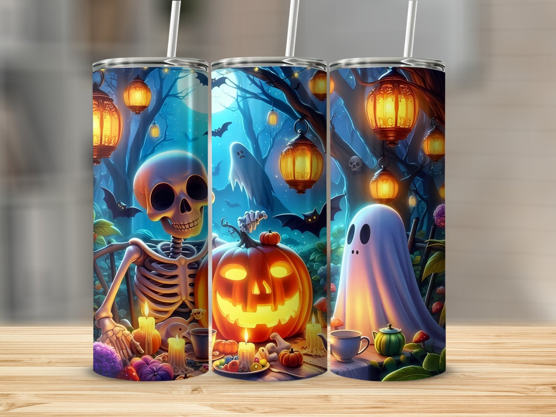 Three tumblers with Halloween designs featuring a skeleton, jack-o-lantern, and ghost.