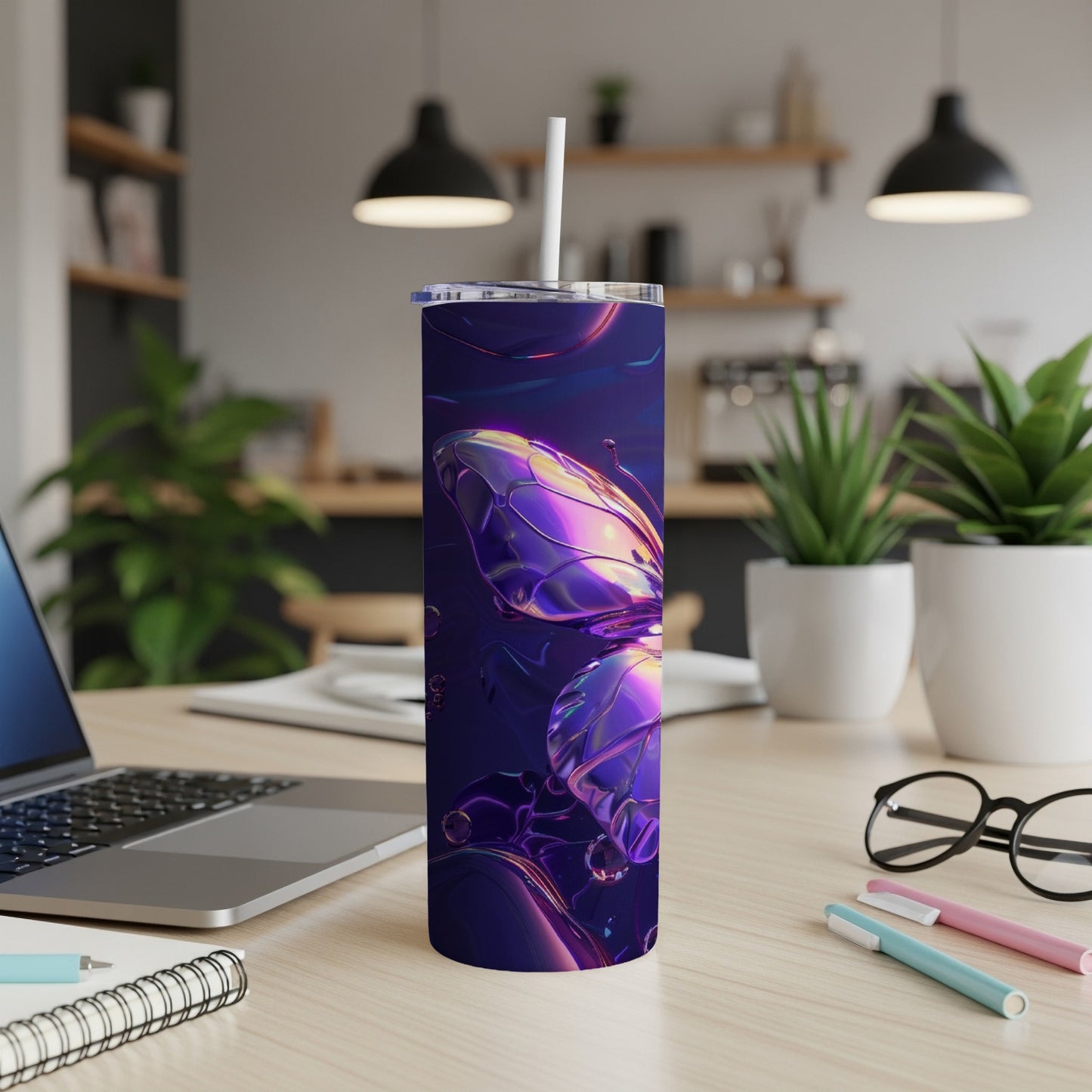 Purple iridescent butterfly tumbler with straw on a desk.