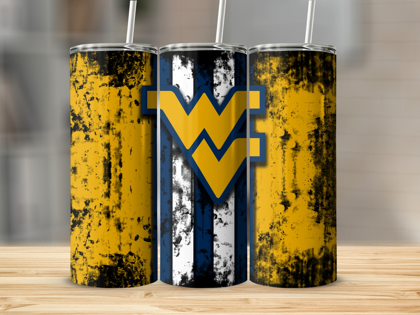 West Virginia Mountaineers W logo on a distressed yellow and blue striped tumbler.