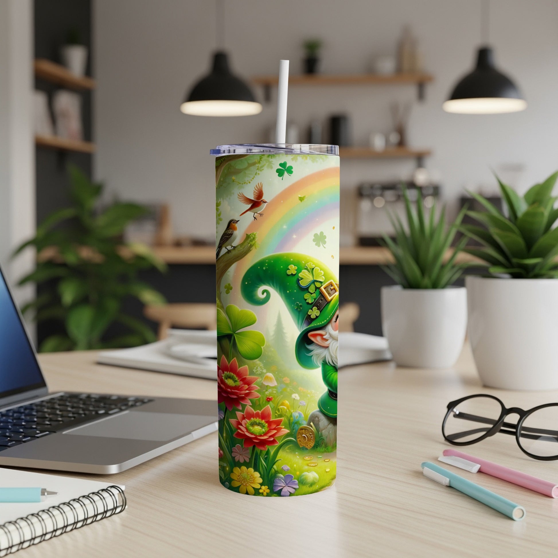 Leprechaun and bird with rainbow and shamrocks on a tumbler.