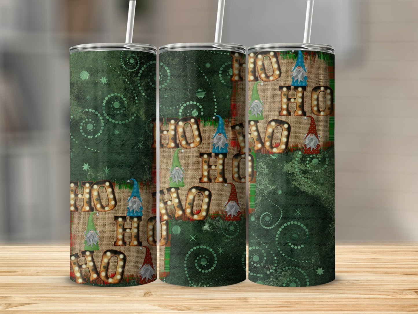 Three tumblers with a "HO HO HO" design featuring gnomes and burlap texture.
