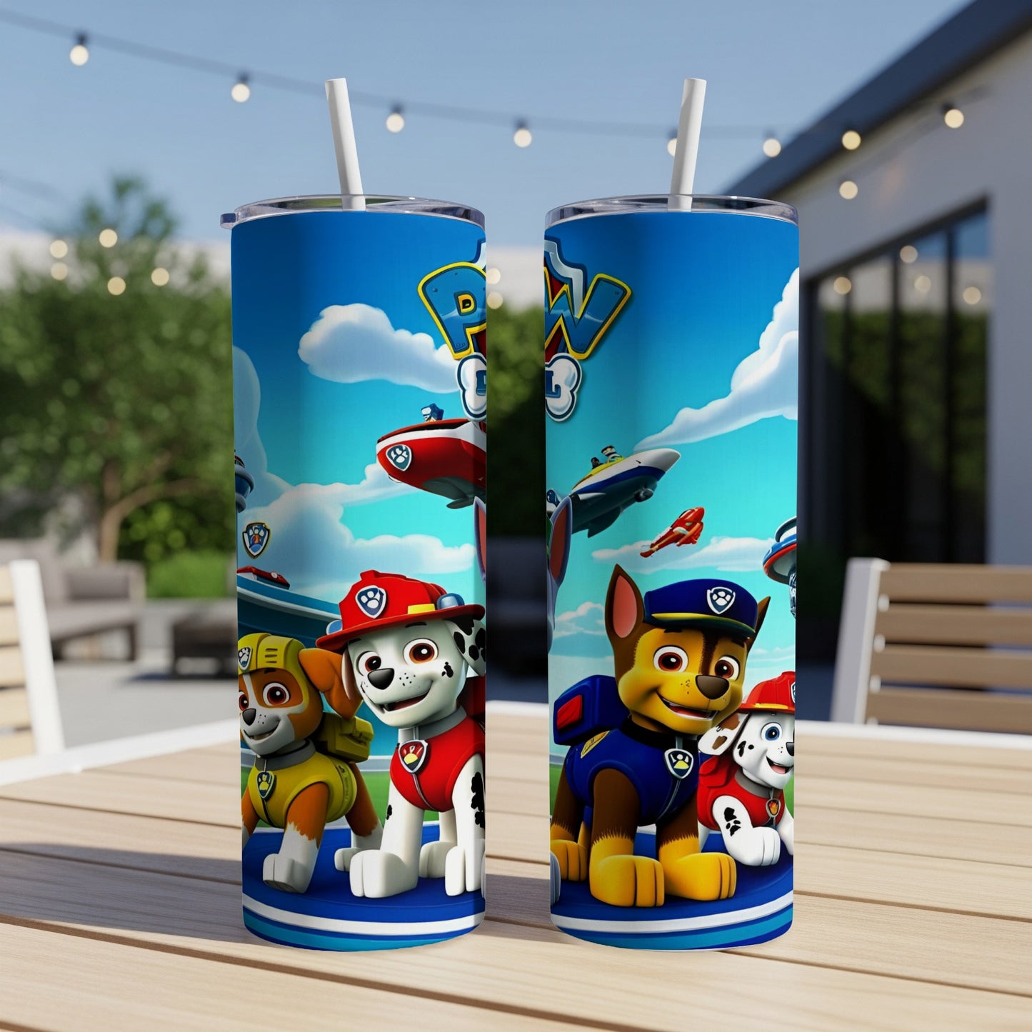 Two Paw Patrol tumblers with characters Ryder, Chase, and Marshall on a table.