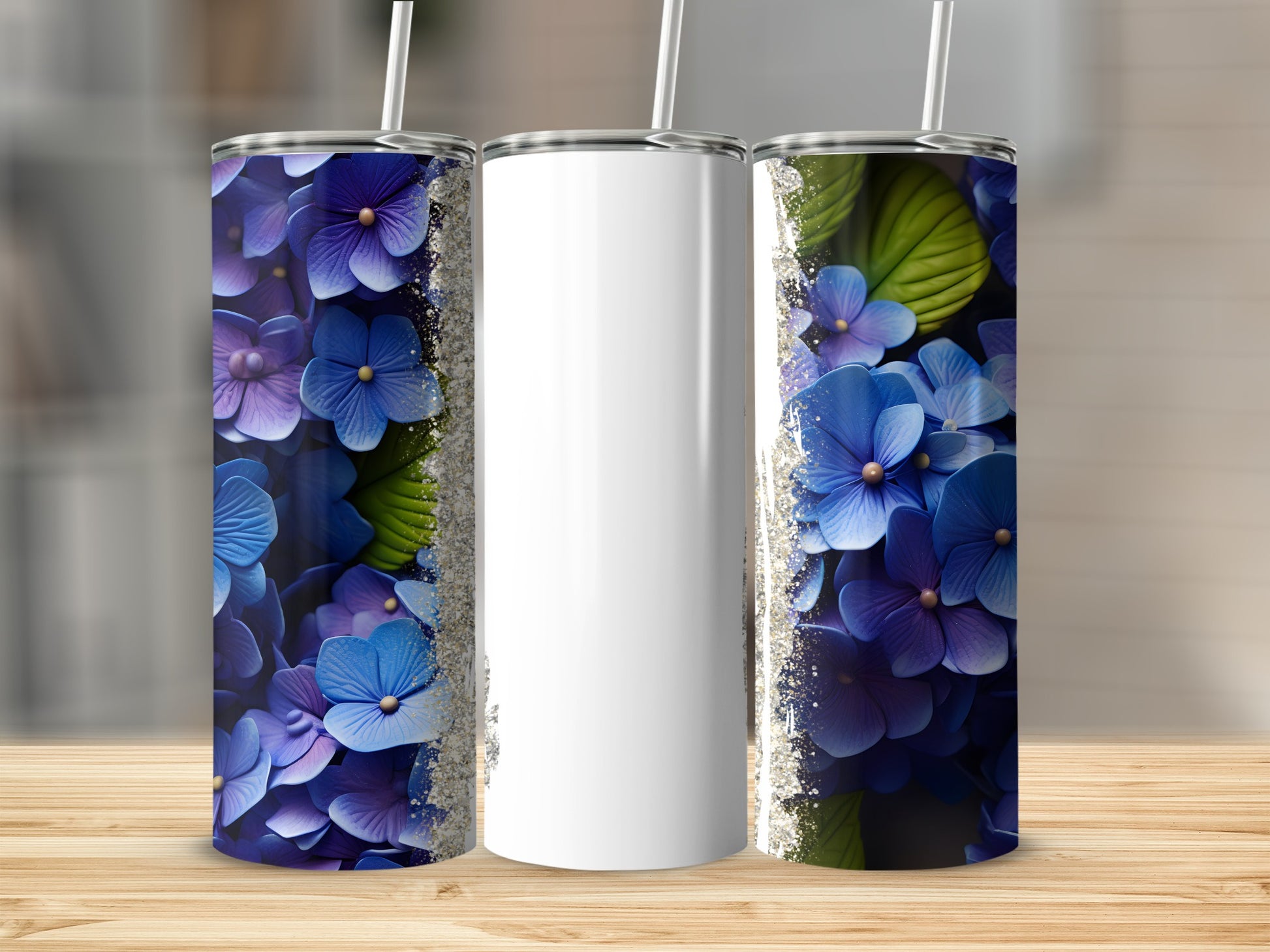 Three floral tumblers with blue and purple hydrangeas and silver glitter accents.