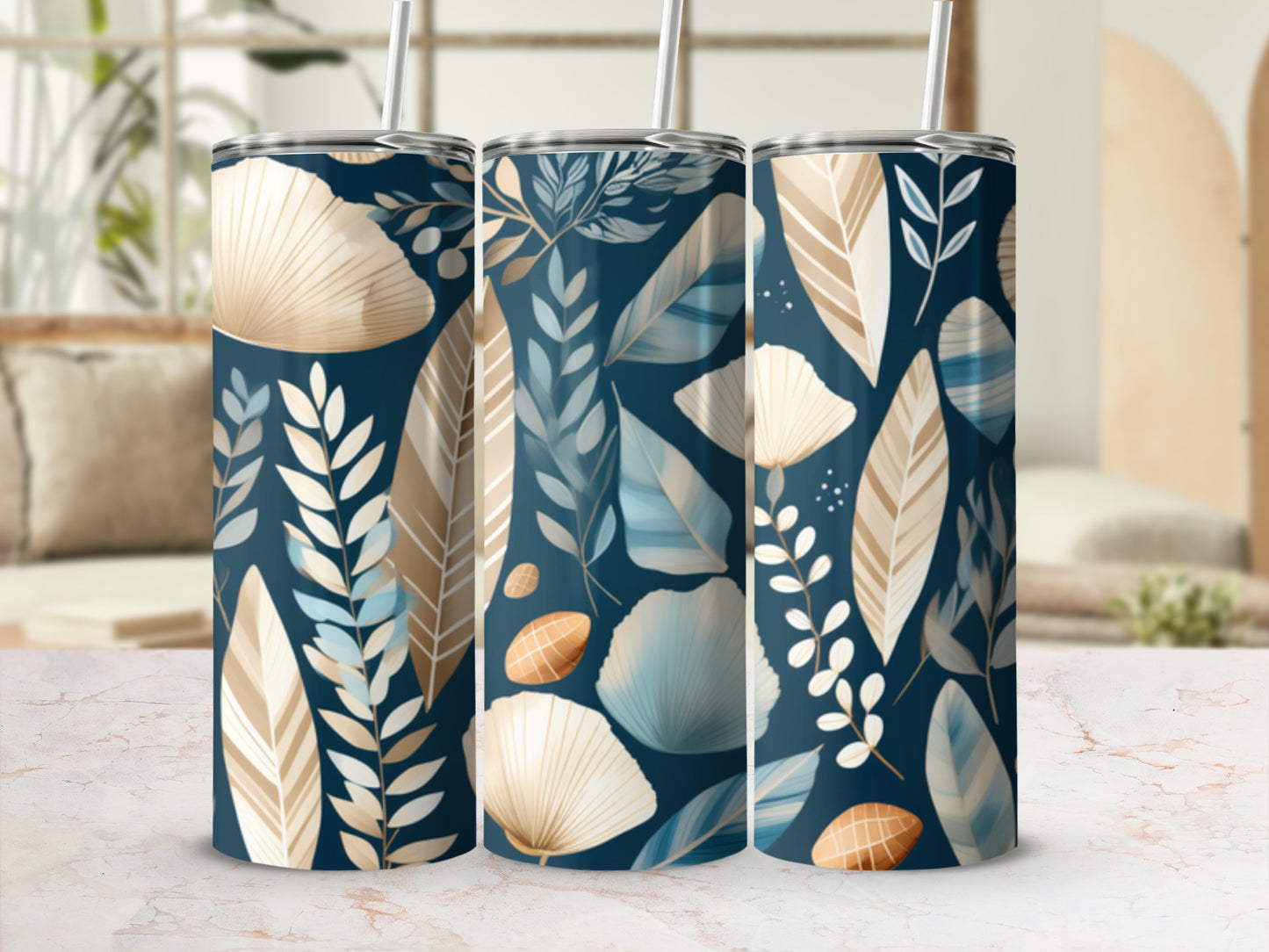 Three tumblers with a teal, tan, and blue leaf and seashell pattern.