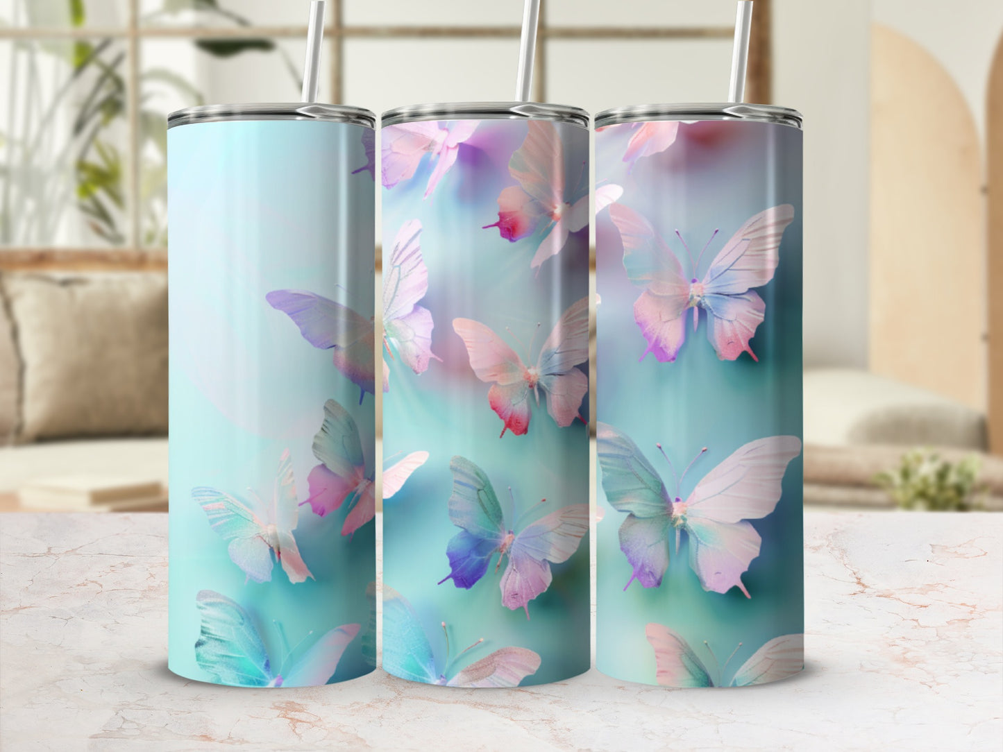 Three tall tumblers with a pastel butterfly design.