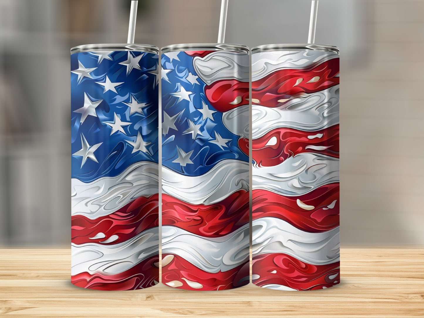 Three tumblers with abstract American flag design on wooden surface.